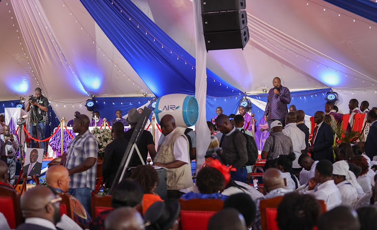 Former President Uhuru Kenyatta addressing mourners at Odera Akang’o University for the burial of former Education CS George Magoha on February 11, 2023.