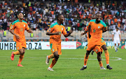 Ivory Coast's Nicolas Pepe celebrates with his teammates after scoring a wonderful solo goal against Algeria in Douala on January 20 2022.