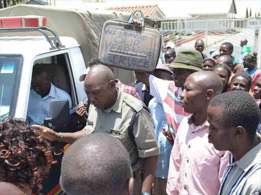 Some of the more than 2,000 sacked workers from Karuturi Flower fi rm in Naivasha hold a peaceful demonstration outside the company’s offi ces demanding their Sh227 million dues after the farm was closed down fi ve months ago over unpaid debt /GEORGE MURAGE