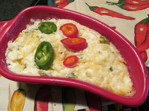 Jalapeno Popper Dip topped with a few slices of peppers