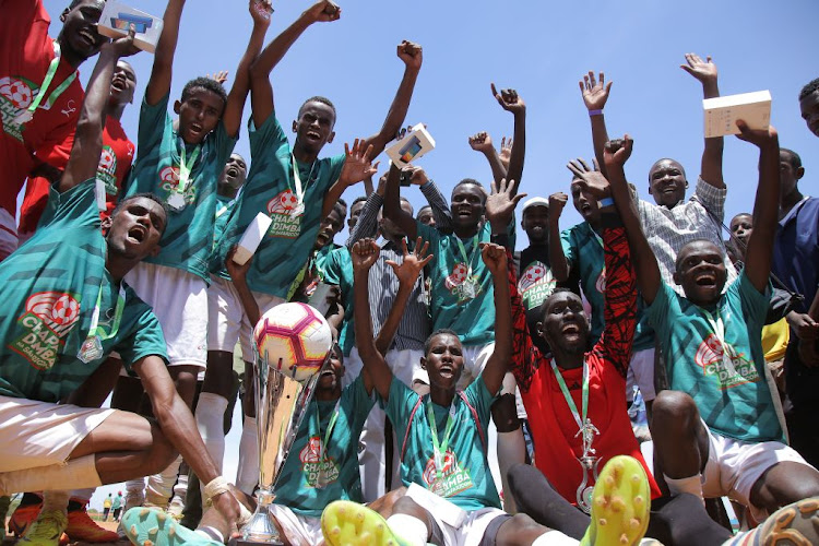 Berlin FC players celebrate after being crowned winners of Chapa Dimba Na Safaricom North Eastern Regional Finals. Berlin won 4-3 on penalties shoot out.