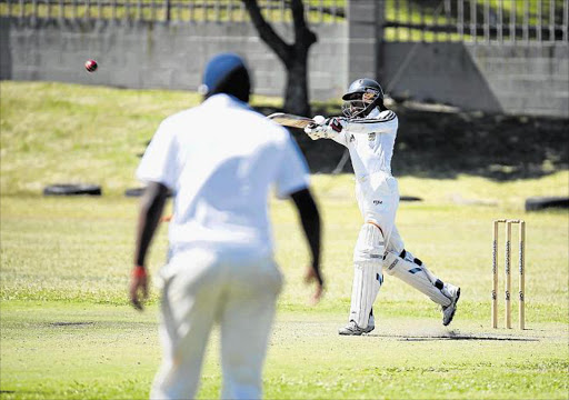 PULLING LOOSE: Fort Hare's Sive Xaluva sends a short delivery off to the boundary during Varsity Week play Picture: MARK ANDREWS