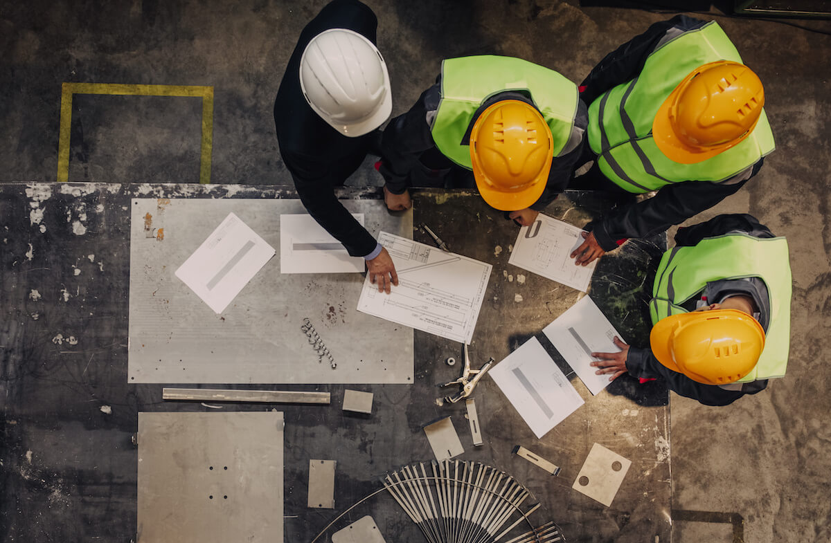 OSHA inspection: engineers and architects going over building plans