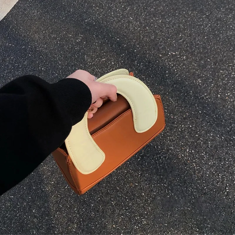 Nieuwe Schattige Klei Handtas Dames Contrast Kleur Messenger Bag. Een stijlvolle en unieke tas, perfect voor dagelijks gebruik en speciale gelegenheden.