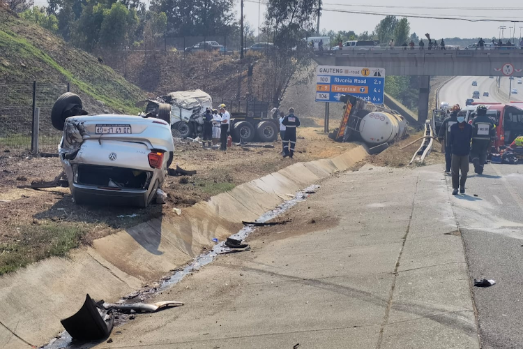 ER24 said a chemical truck was lying on its side and two light motor vehicles were a short distance away, one alight and the other on its roof.