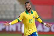 Neymar Jr. of Brazil celebrates after scoring the fourth goal of his team during a match between Peru and Brazil as part of South American Qualifiers for Qatar 2022 at Estadio Nacional de Lima on October 13, 2020 in Lima, Peru. 