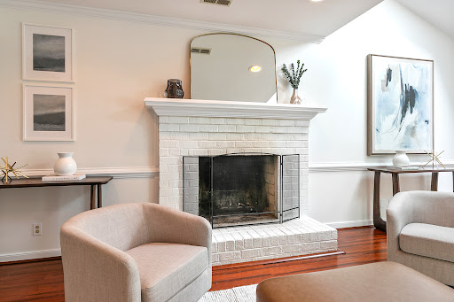 Living room with fireplace and armchairs - Prestige house for sale in Chester, 4 bedrooms