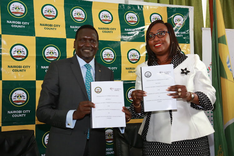 President of National Olympic Committee of Kenya (NOCK) Paul Tergat and Nairobi Deputy Governor Anne Kananu during the signing of the MoU to construct Sh 35 million OlympAfrica Sports Centre in Ruai on March 3, 2021