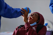 A Nigerian student takes a Covid-19 test at the Nnamdi Azikiwe International Airport upon arrival from Ukraine after fleeing the invasion by Russia, in Abuja, , Nigeria March 4, 2022. 