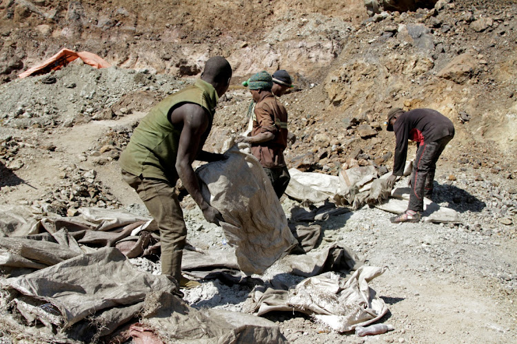 Workers at Tilwizembe, a former industrial copper-cobalt mine outside Kolwezi, the capital city of Lualaba province in the DRC, in 2016. Picture: REUTERS/KENNY KATOMBE