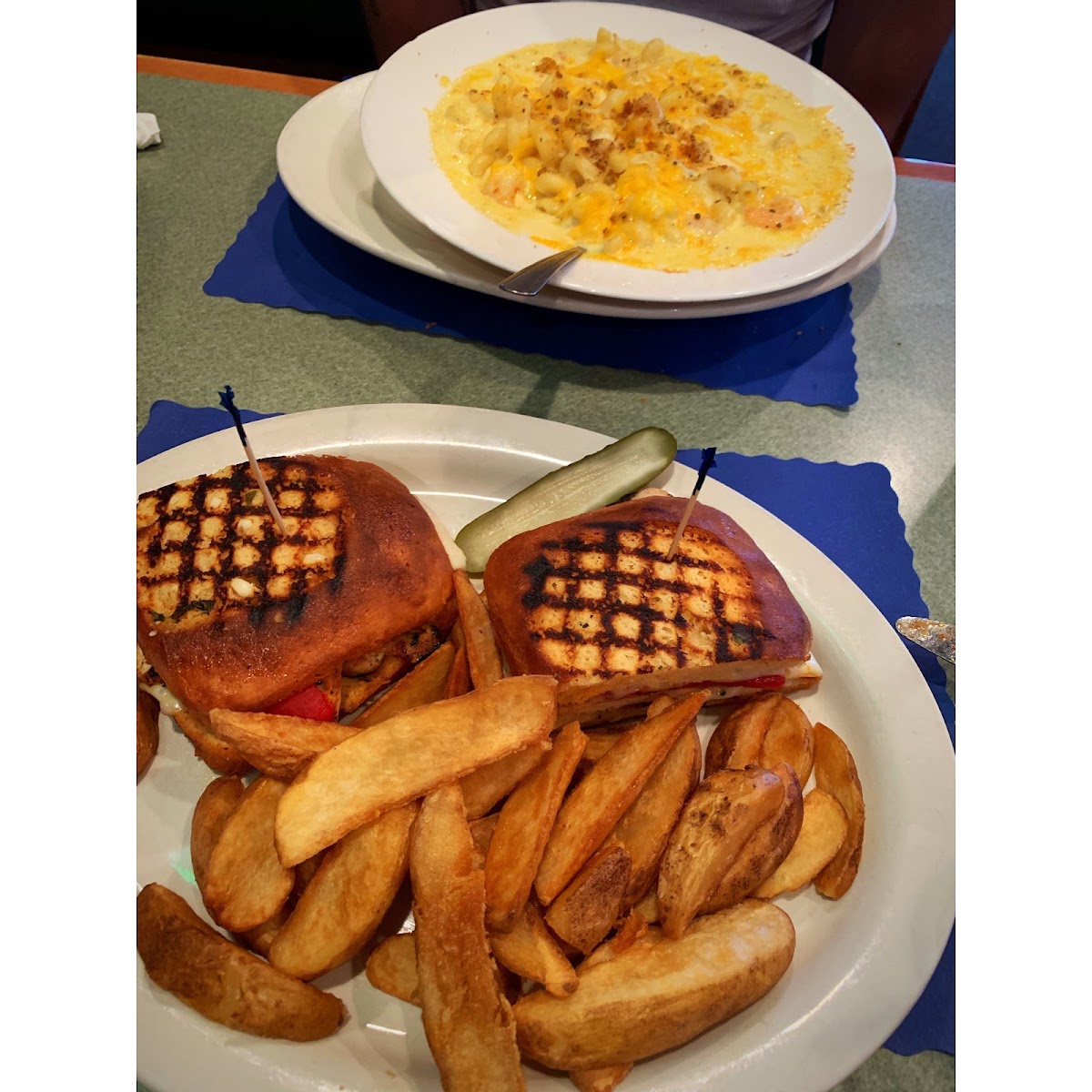 grilled chicken pesto panini with potato fries and pickle