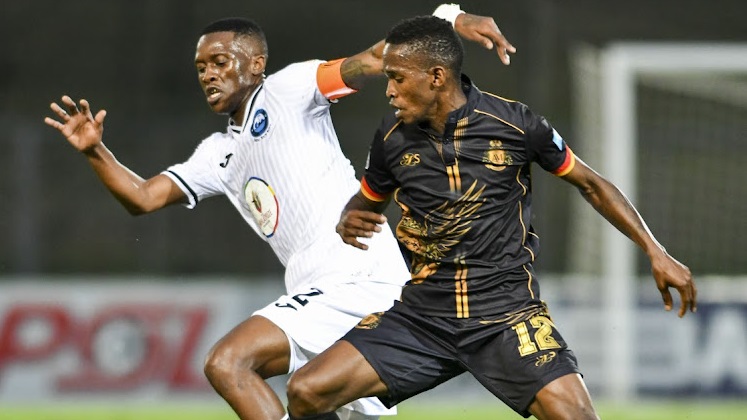 Kabelo Mahlasela of Royal AM, right, and Katlego Maphathe, the captain of Richards Bay, during their Dstv Premiership match at Chatsworth Stadium yesterday.