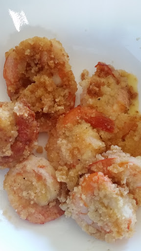 Jumbo prawns rolled in coconut flour mixture and fried in virgin coconut oil