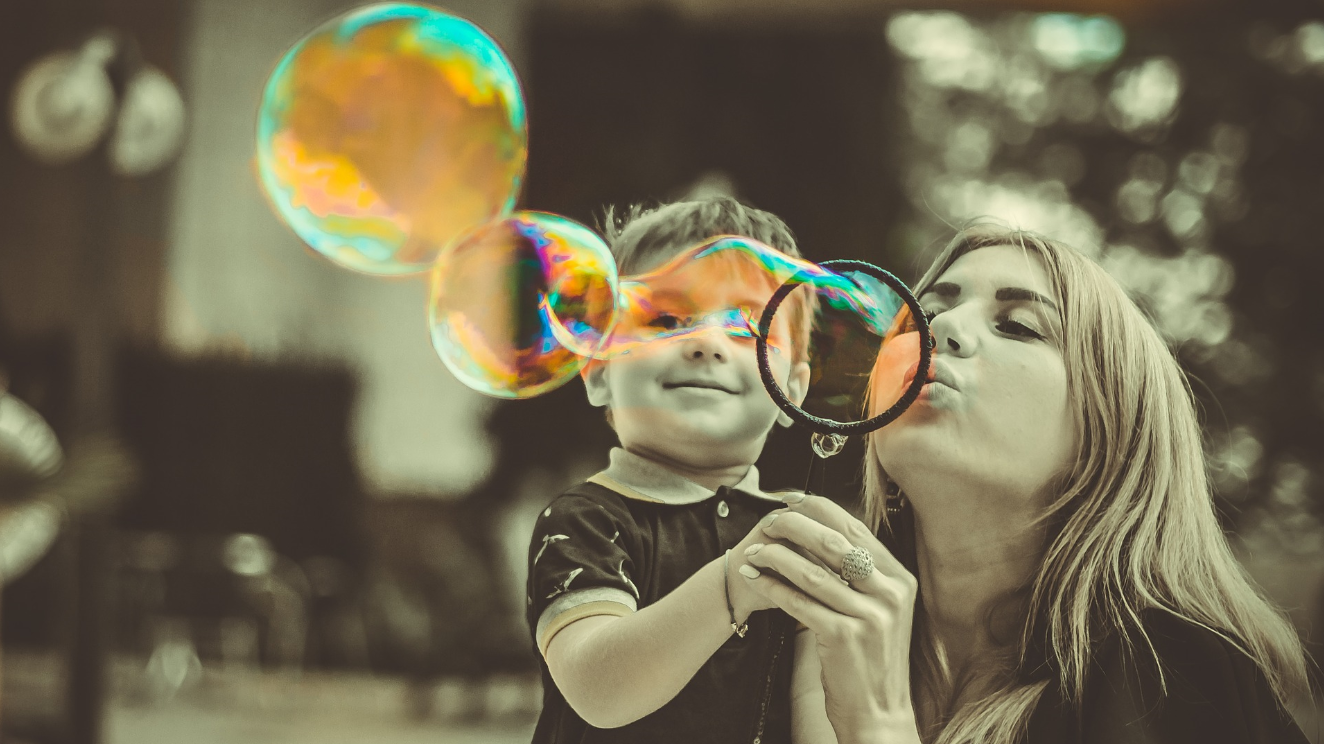 Mom and son blowing bubbles