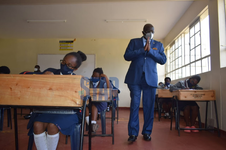 Education CS George Magoha on an inspection tour at St. Georged secondary school as candidates sit their KCSE examination on March 30, 2021.