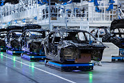 Mercedes EQS electric sedans being assembled on the carmaker's Sindelfingen plant. 
