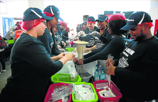 SPREAD THE LOVE: The Daily Dispatch, together with other corporate companies, assisted with the Stop Hunger Now campaign which is an initiative of Nelson Mandela Day celebrated today PICTURE: ALAN EASON