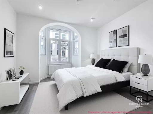 Modern bedroom with white and black bed - Luxury apartment / penthouse for sale in Ixelles, 2 rooms, 1 bedroom