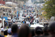 An overview of a street in Alexandra as residents head to the stadium to be addressed by President Cyril Ramaphosa