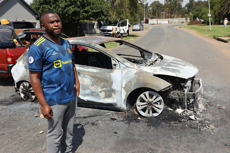 Mineworker Prince Radebe's car was burnt during a protest at Gold One mine in Springs, Ekurhuleni.