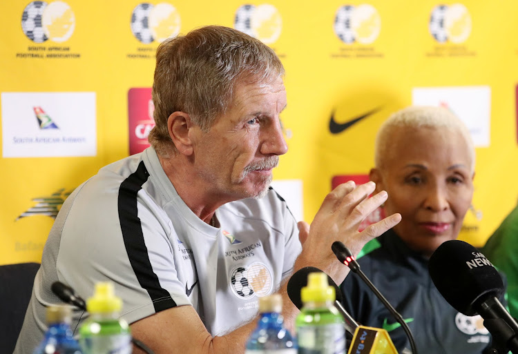 Bafana Bafana head coach Stuart Baxter (L) speaks to the media in Johannesburg on March 26 2019 as the SA Football Association vice-president Ria Ledwaba listens.