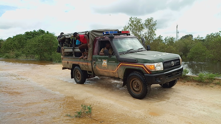 A police land cruiser ferries security officers to the operation zone in Boni areas,Lamu.