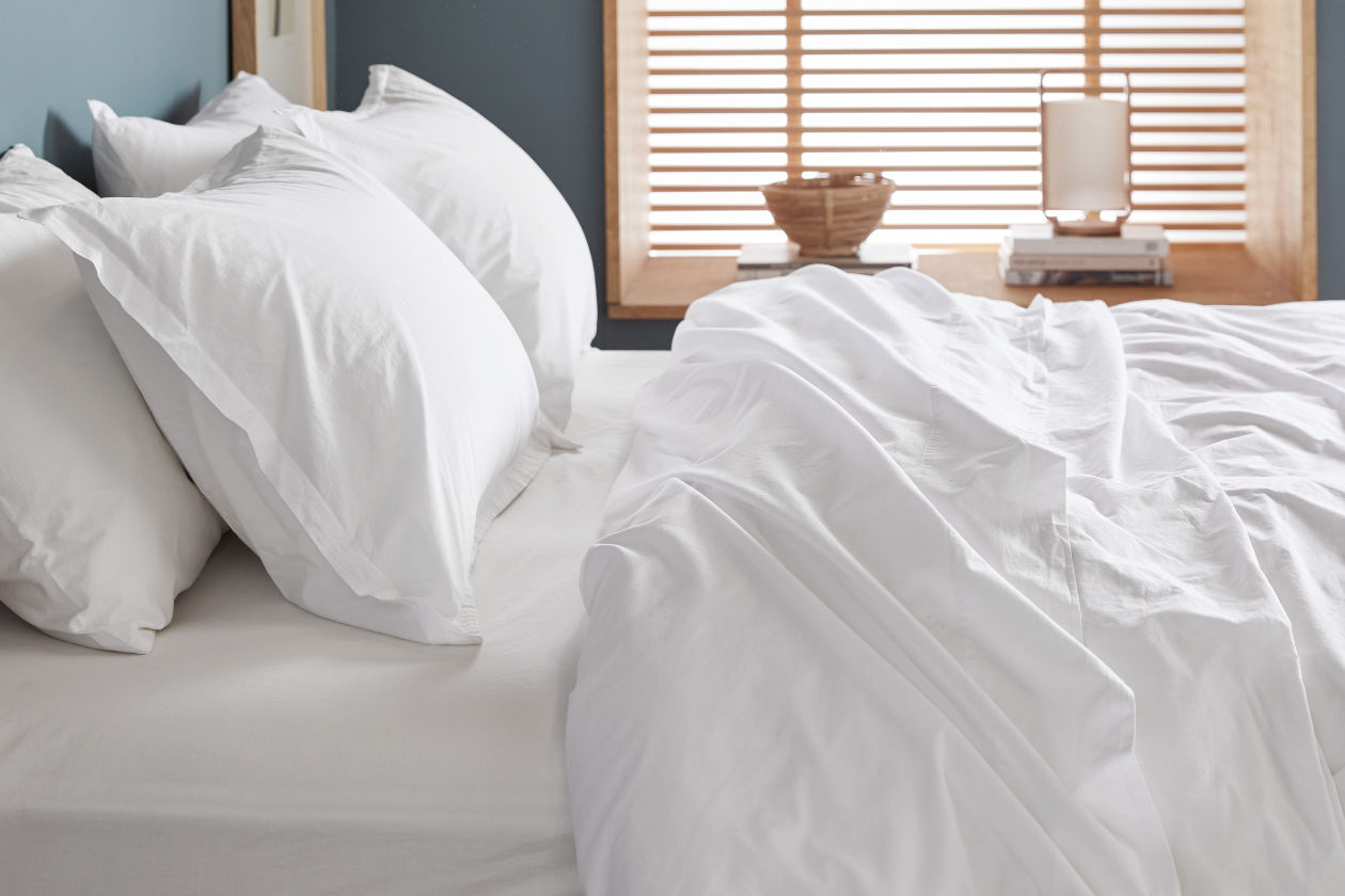 Bed with white sheets