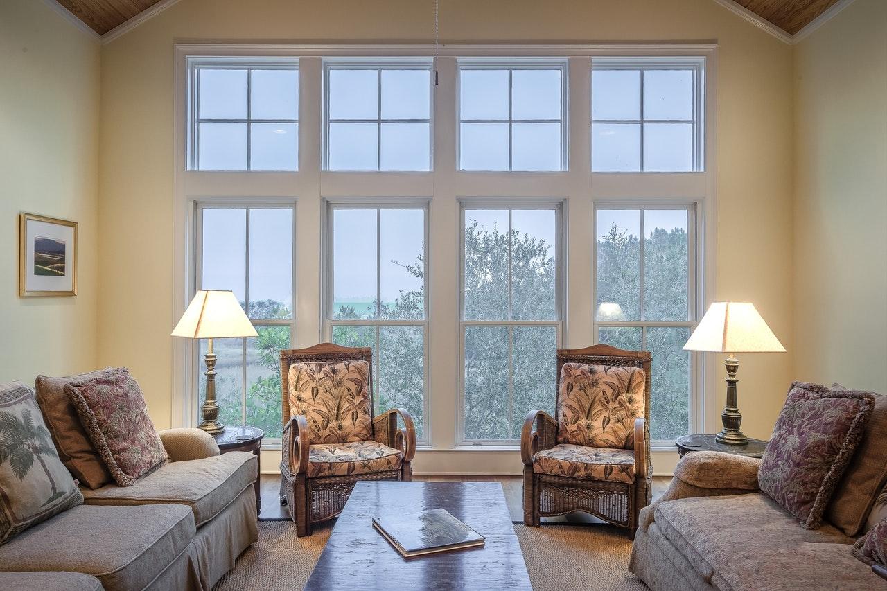 A living room with large impact windows.