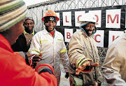 SWEAT EQUITY: Mineworkers in the platinum belt return to work after their marathon wage strike Picture: SIMPHIWE NKWALI