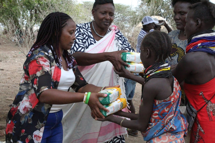 KVDA staff distribute relief food in Turkana North on September 28, 2021