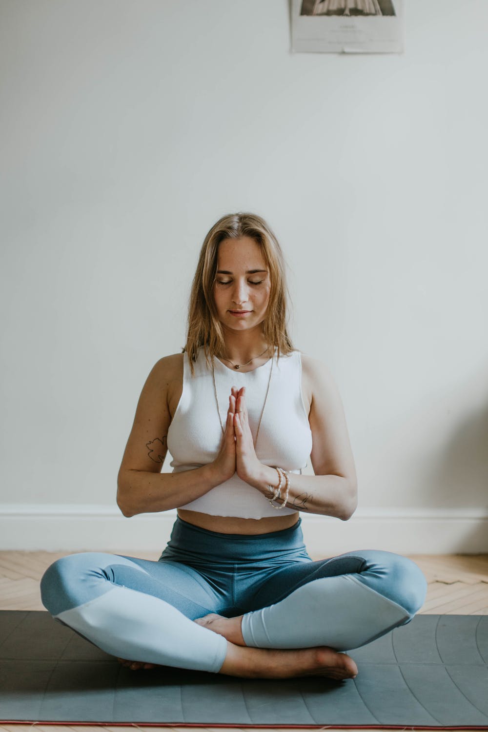 woman sitting in a yoga position, healthcare
