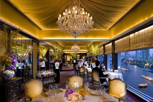 The dining room at Le Normandie, inside Mandarin Oriental, offers scenic views of the Chao Phraya river in Bangkok. 