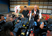 RED WIRE OR BLUE?  Bomb disposal experts Rene Bennert and Dieter Schweizler with the World War 2 bomb they defused Picture: Kai Pfaffenbach/Reuters