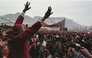 Archbishop Desmond Tutu rejoices after receiving the freedom of the City in Cape Town in 1998.