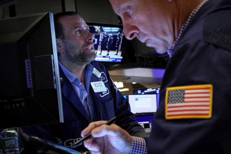 Traders work on the floor of the New York Stock Exchange in New York, US. File photo: REUTERS/BRENDAN MCDERMID