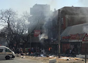 Some buildings in Pretoria were looted and set on fire on Wednesday morning. 
