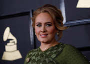 Singer Adele has opened up on her divorce and dramatic weight loss ahead of the release of her new single. File photo.