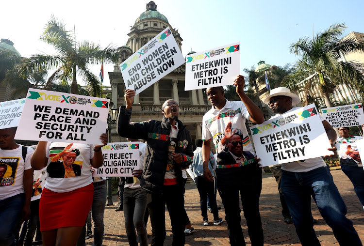 IFP members protest outside the Durban City Hall over the ANC government's failures, especially regarding the plight of flood victims, transit camps, rampant crime, unemployment and the gender-based violence pandemic.