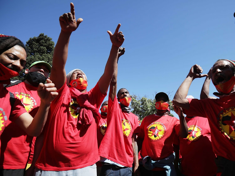 Workers affiliated with the National Union of Metalworkers of South Africa during their strike for better wage increases at the Bellville South community centre in Cape Town on 05 October 2021.