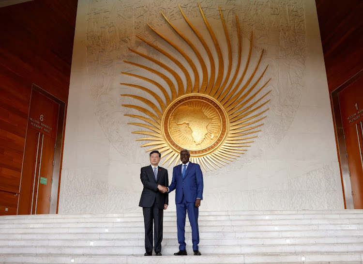 China's foreign minister Qin Gang and the AU commission chair Moussa Faki pose after a meeting at the AU headquarters in Addis Ababa, Ethiopia, January 11 2023. Picture: TIKSA NEGERI/REUTERS