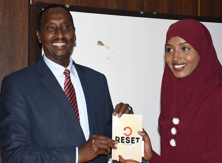 Wajir Governor Mohamed Abdi and author Misky Haji during the launch of her book, 'Reset', at a Nairobi hotel