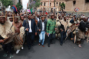 Prince Simphiwe Zulu, (in green) together with a group of Amabutho, gathered outside Pretoria High Court pledging support to King Misuzulu Zulu. 