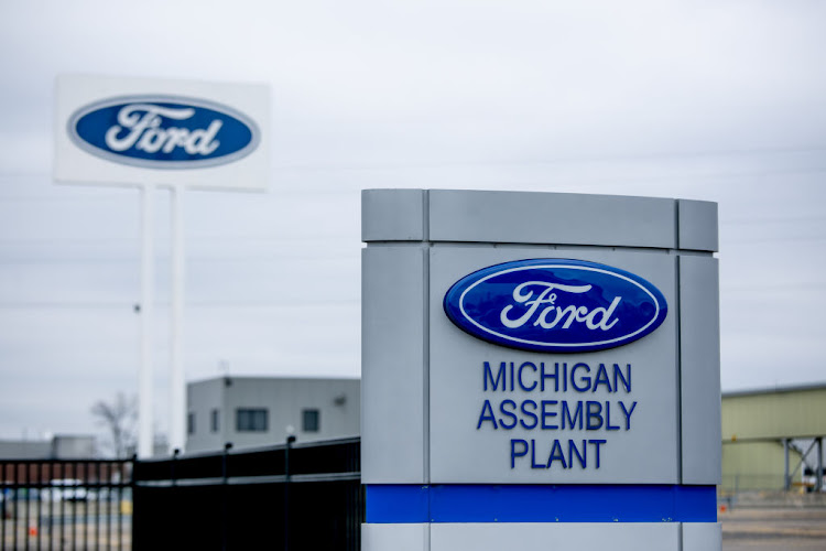 Signage displayed outside the idled Ford Motor Co Michigan Assembly plant in Wayne, Michigan. US President Donald Trump toured the plant on Thursday and chose not to wear a protective face mask.