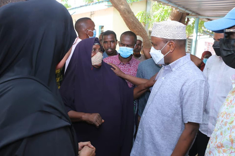 Garissa governor Ali Korane charts with residents and patients at the Garissa County Referral Hospital when he made an impromptu visit on Saturday morning.