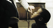 HARD TO SWALLOW: A boy is fed like a dog in the advert for the Feed a Child NGO, which has been reported to the Advertising Standards Authority of SA and slammed by the public - but defended by the organisation