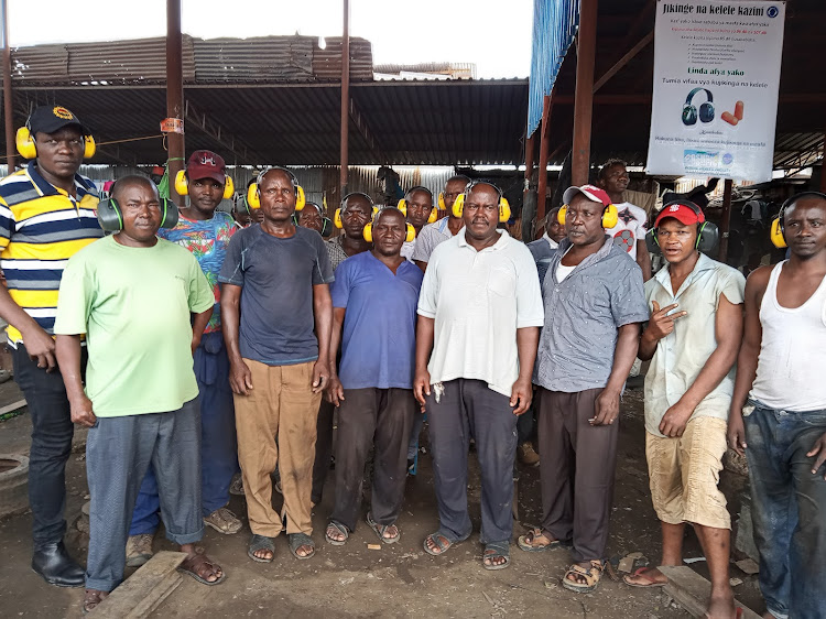 Sparki Juakali area artisans wearing the ear muffs they received from the OshPro services on Tuesday, June 7.