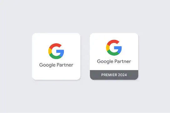 Hai huy hiệu Google thể hiện sự khác biệt giữa huy hiệu Đối tác của Google và huy hiệu Đối tác xuất sắc của Google.