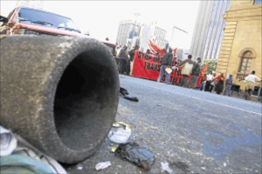 GIVE US MORE: Members of the SA Municipal Workers Union trash streets in downtown Johannesburg during a previous protest march. Photo: sydney seshibedi