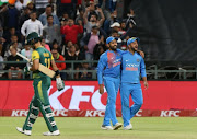 India celebrates the wicket of South African captain JP Duminy during the 3rd KFC T20 International match between South Africa and India at PPC Newlands on February 24, 2018 in Cape Town.