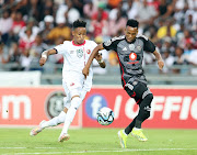 Orlando Pirates attacker Relebohile Mofokeng in a tussle for the ball with Morena Monaheng of Hungry Lions during their Nedbank Cup last 16 match at the Orlando Stadium.